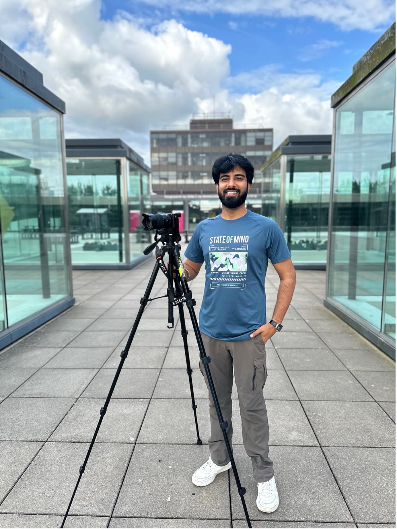 Sachin posing for a photo with his film camera