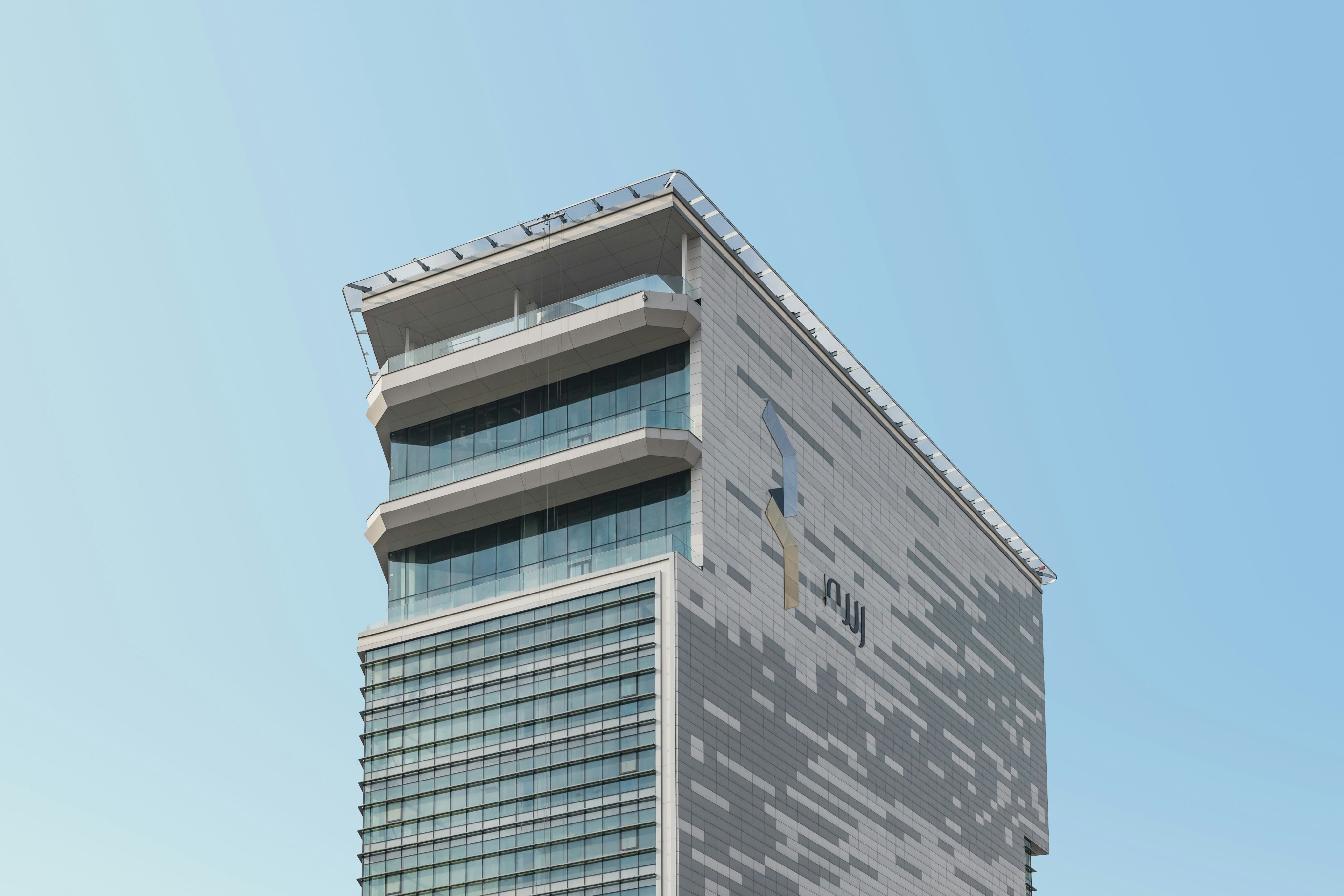 a tall building with a sky background